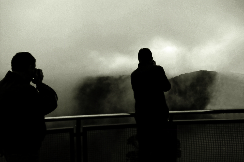 Men trying to photograph through mist at Echo Point